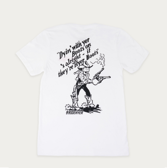 A white short-sleeve t-shirt with a black graphic print on the front. The graphic features a cowboy character, accompanied by the text 'Dyin' with yer Boots on's alright - if they're Hyer Boots' and the hashtag '#RIDEHYER'.