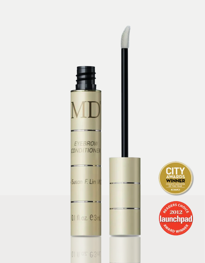 MD® Eyebrow Conditioner by Susan F. Lin, M.D. with its precision applicator, shown with ICMAD City Awards and 2012 Launchpad Readers' Choice award badges