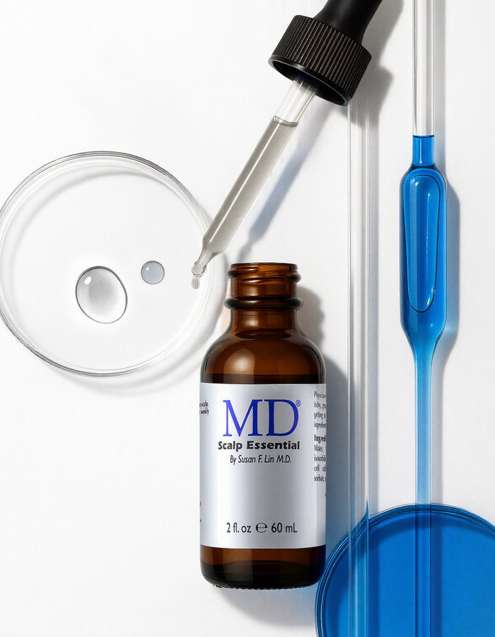 MD® Scalp Essential scalp serum bottle with a dropper and laboratory glassware