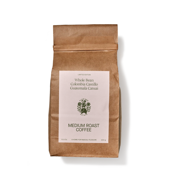 A brown paper coffee bag stands upright.