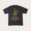 A faded black short-sleeve t-shirt shown from the back, featuring a large graphic print of a cowboy riding a bucking bronco. Below the graphic, the text reads 'RIDE HYER COWBOY BOOTS' in teal and orange-red lettering, with 'Est 1975' and 'KANSAS CITY, USA' printed underneath.