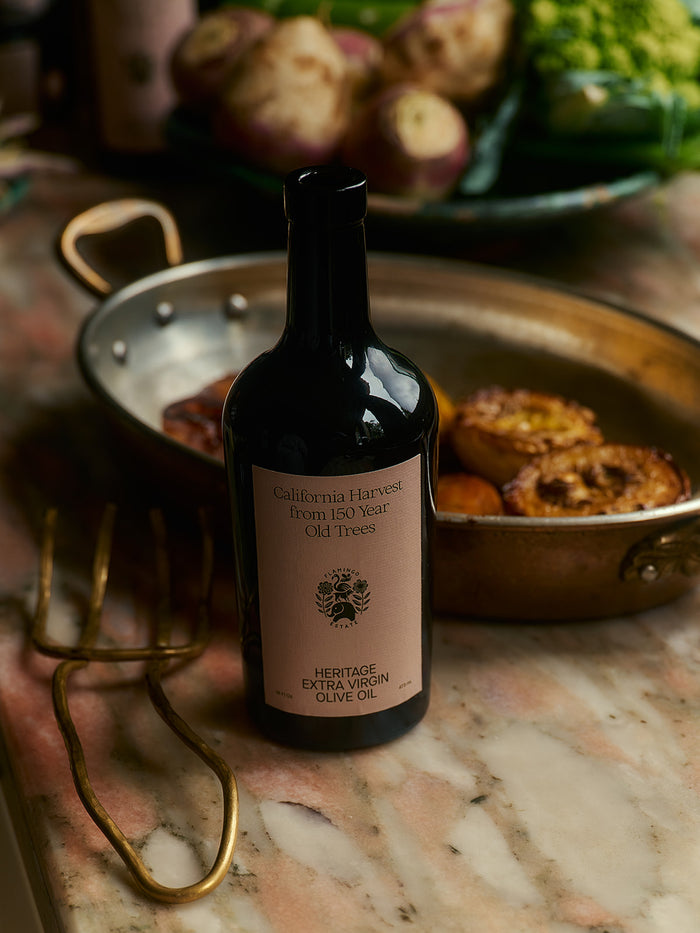 A bottle of "California Harvest from 150 Year Old Trees, Heritage Extra Virgin Olive Oil."